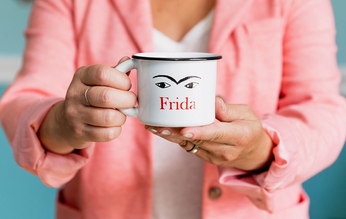 Emily Montes de Oca holding a Frida coffee cup